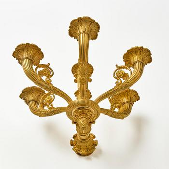 A pair of French Empire six-branch ormolu appliques, ca 1820's.