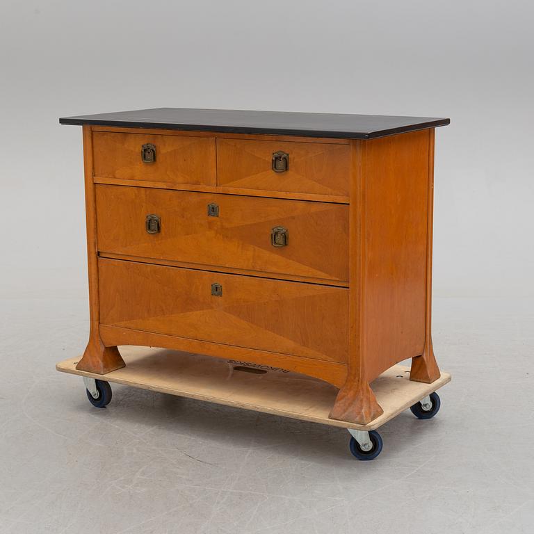 An early 20th century art nouveau chest of drawers.