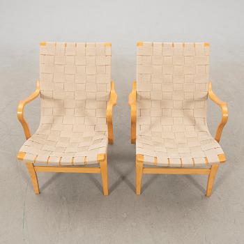 Bruno Mathsson, a pair of "Eva" armchairs for DUX, late 20th century.