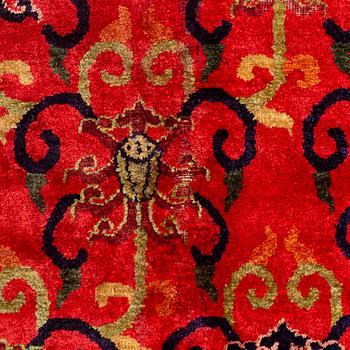 An East Turkestan silk carpet, ca 308 x 182 cm.