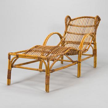 A mid-20th century rattan lounge chair.