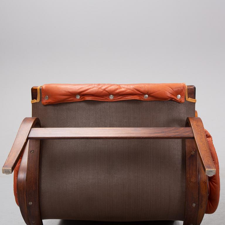 An end of the 20th Century pair of 'Pernilla' easy chairs with leather upholstery by Bruno Mathsson for DUX.