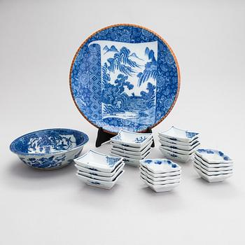 A dish, a bowl and 24 small bowls in blue and white porcelain, 20th Century.