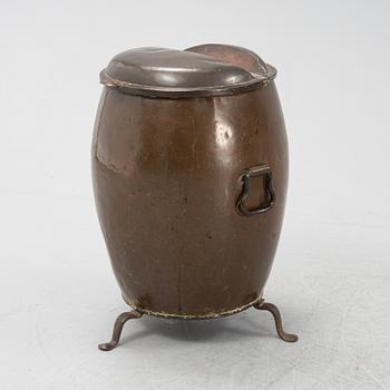 A copper water container, on iron stands.19th Century.