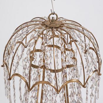 A late Gustavian gilt brass and cut glass thirteen-light chandelier, circa 1800.