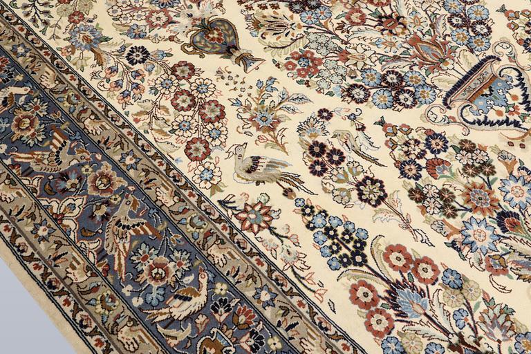 A Shareza carpet, signed, approx. 358 x 254 cm.