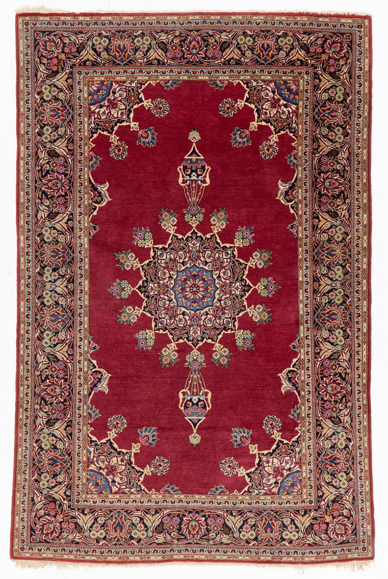An oriental rug, c. 205 x 133 cm.