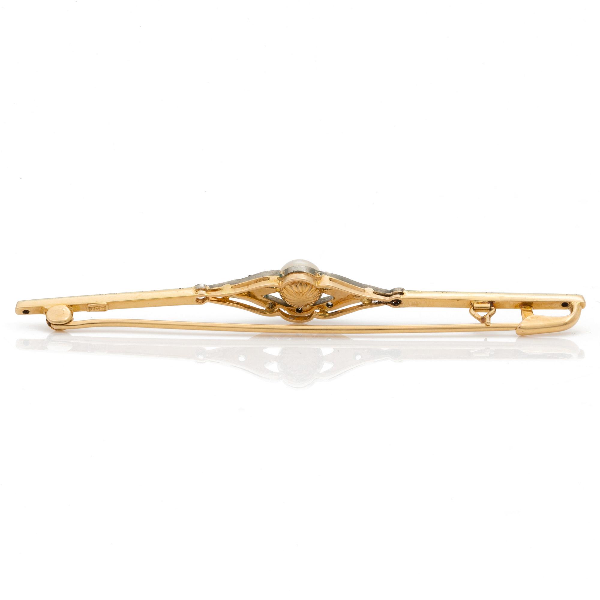 A bar brooch set with a cultured pearl and diamonds.