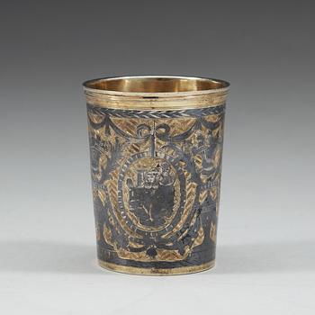 A Russian eraly 19th century parcel-gilt and niello beaker, marked Moscow 1804.