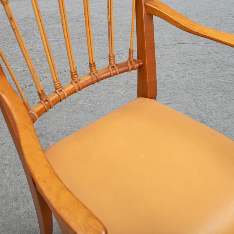 A pair of Josef Frank mahogany and rattan armchairs, Svenskt Tenn, Stockholm, Sweden.