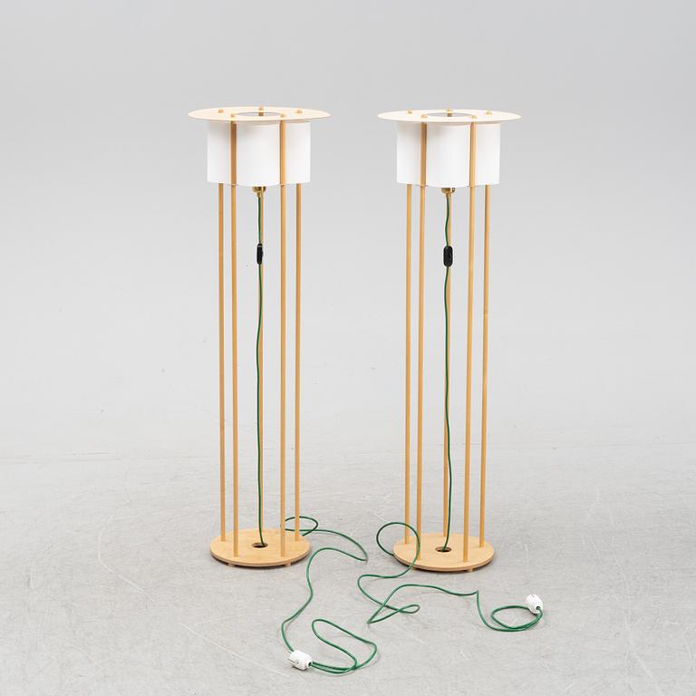 Torbjörn Ahlström, a pair of birch floor lights, dated 1993.