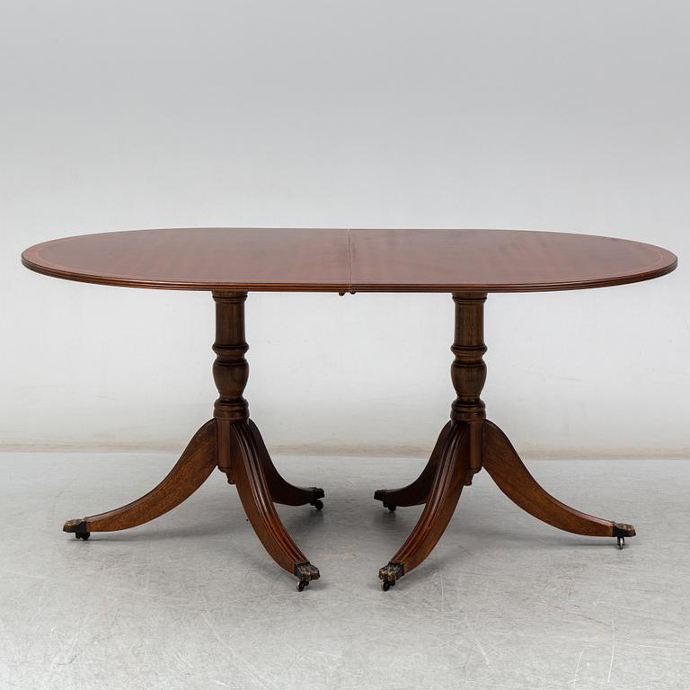 A late 20th century English dining table. One leaf included.