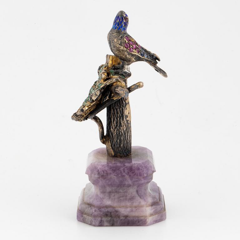 Silver and coloured stone bird sculpture.
