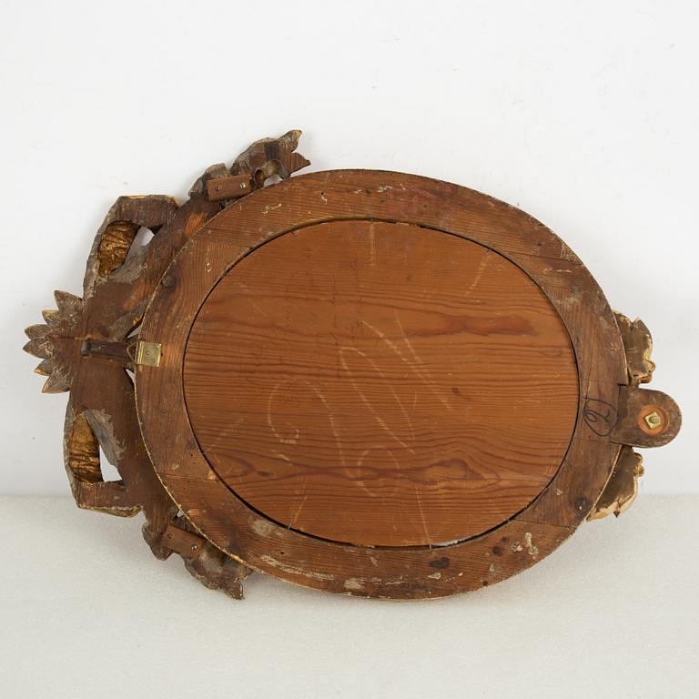 A pair of one-light Gustavian-style giltwood girandole mirrors, late 18th c /resp circa 1900.