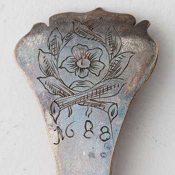 A spoon dated 1688.