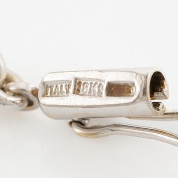 Necklace in 18K white gold with a white stone likely rock crystal and round brilliant-cut diamonds, in the shape of an elephant.