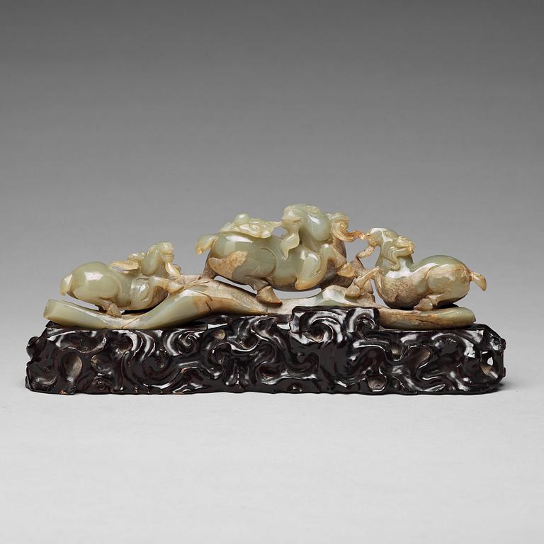 A Chinese nephrite sculpture of three rams.