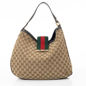 Gucci, GG Supreme bag.