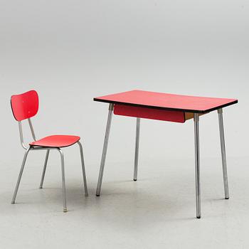 A mid 20th century table and chair.