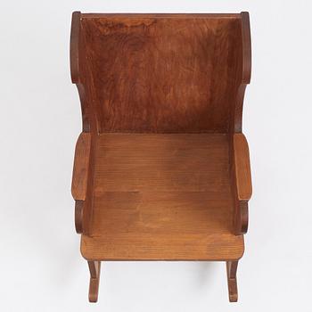 Nordiska Kompaniet, a Swedish Modern stained pine 'Lovö' rocking chair, 1940s.