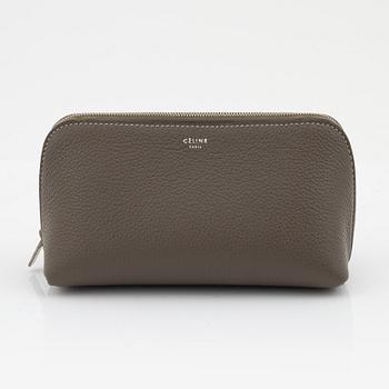 Céline, A small cosmetic pouch in beige leather.