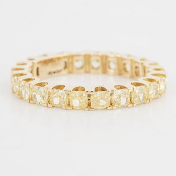 Yellow cushion shaped diamond ring.