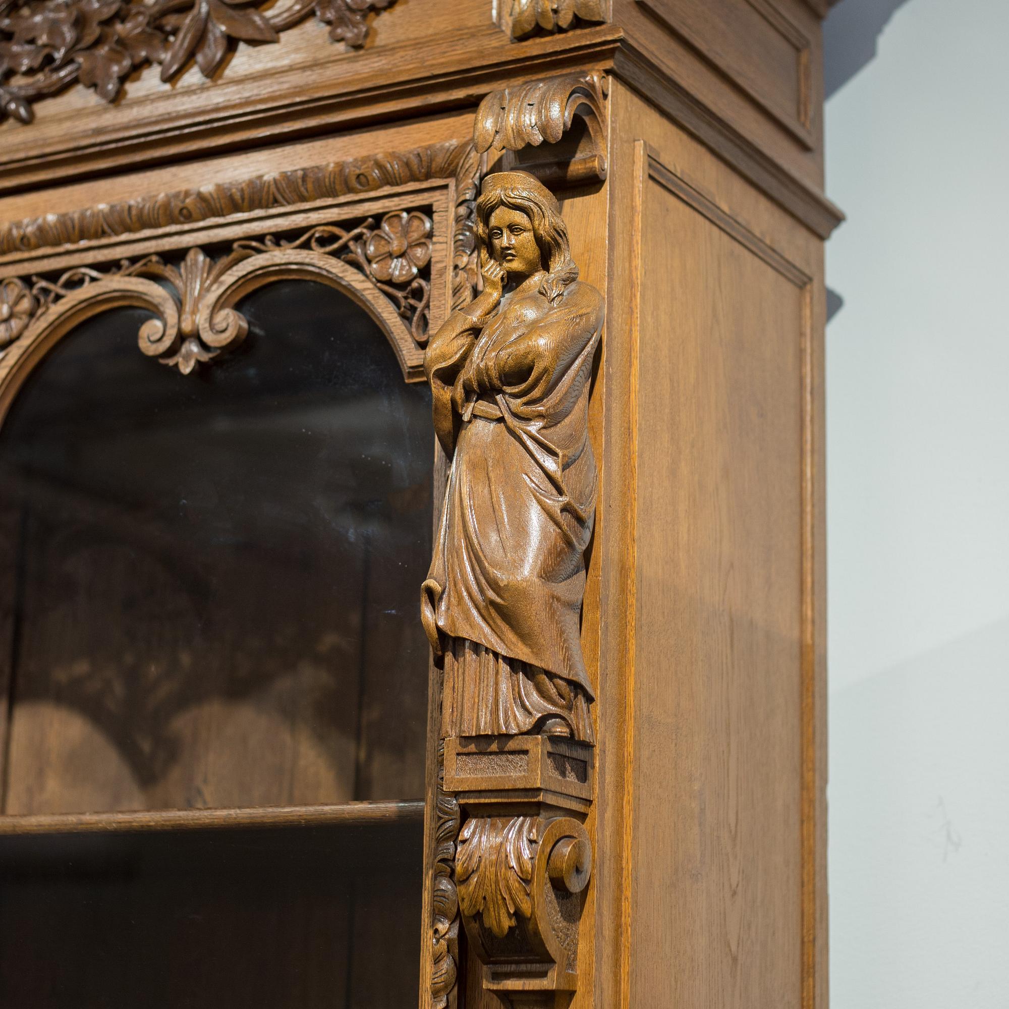 a oak vitrine cabinet from the late 1800's.