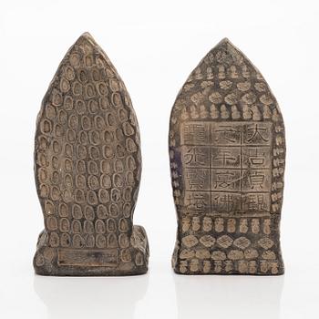 Two steles/tsa tsas, presumably circa 1900.