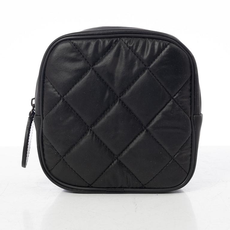 Chanel, tennis racket and 4 balls with case.