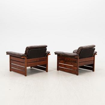 A pair of 1970s leather armchairs.