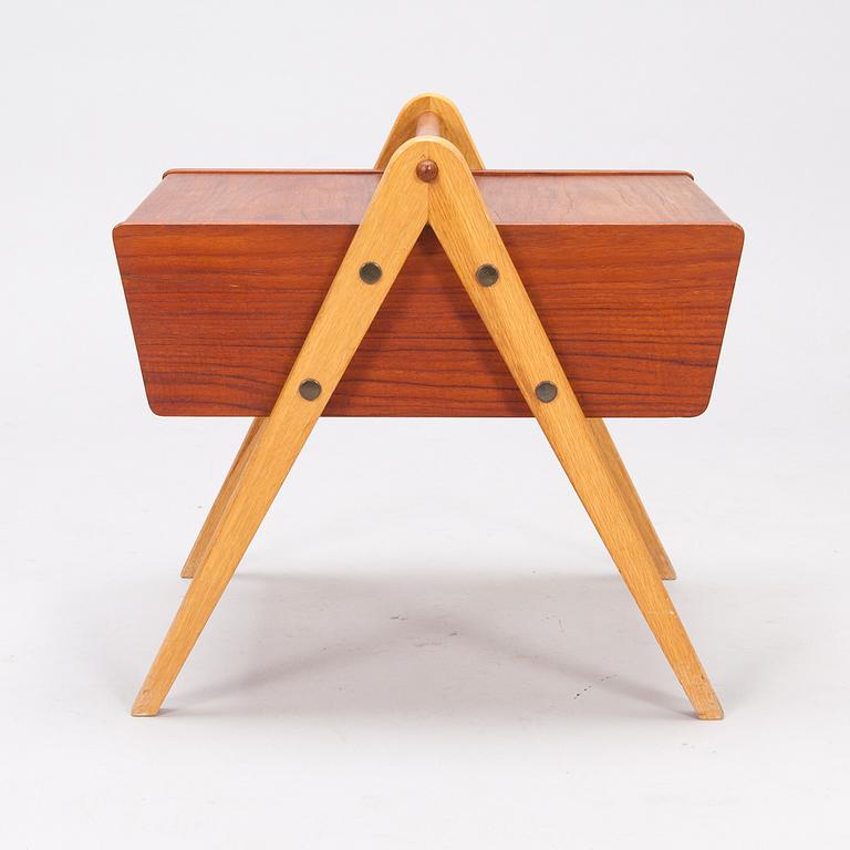 A 1950's sewing table in teak.