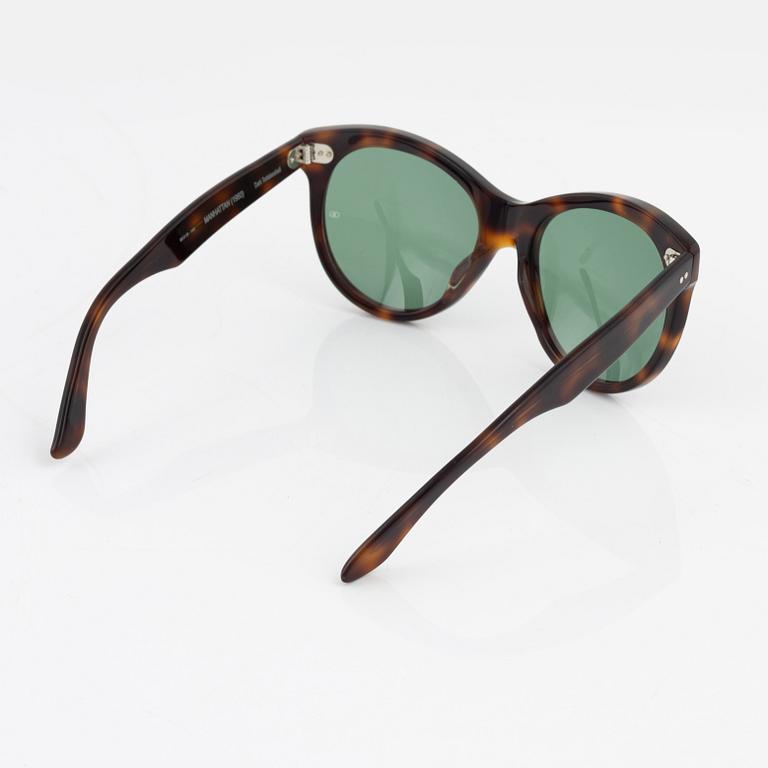 Oliver Goldsmith,a pair of tortoise "Manhattan" sunglasses.