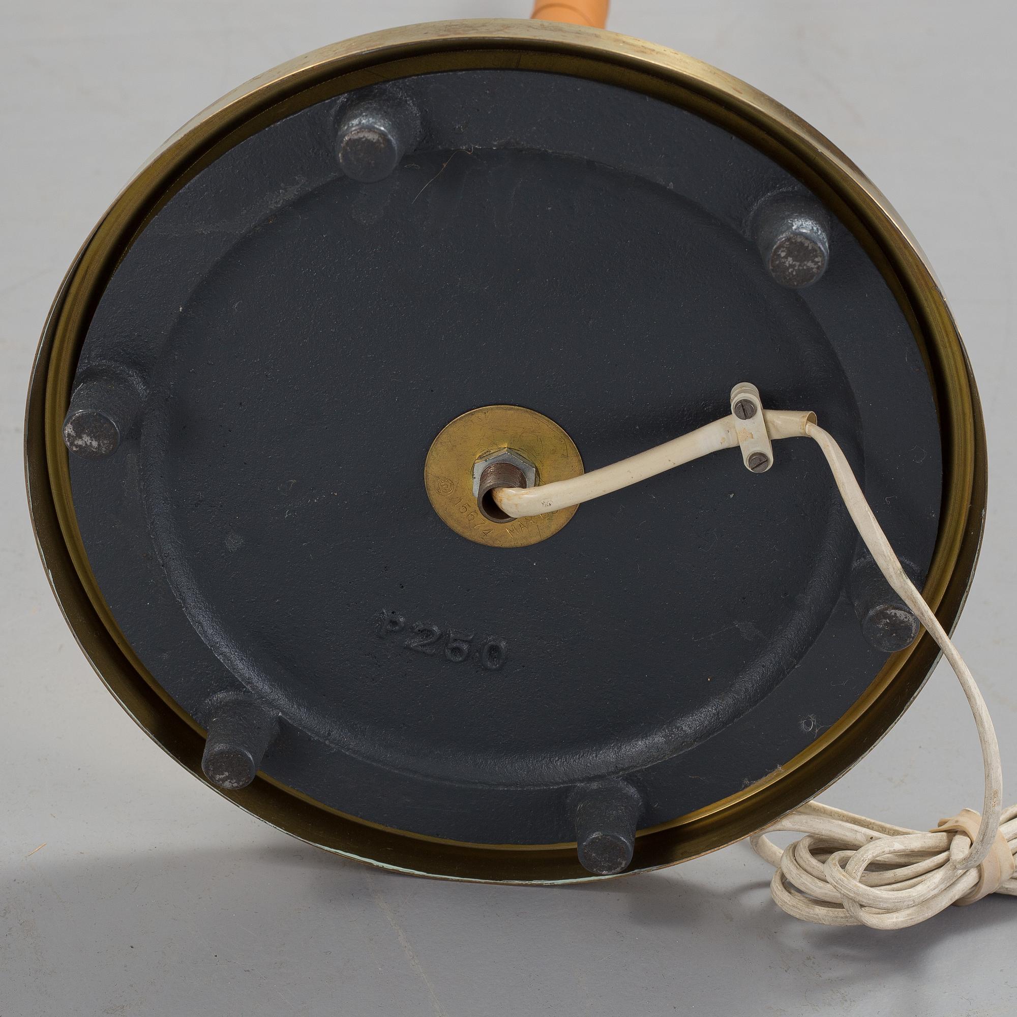 A 1960s brass and leather floor light.