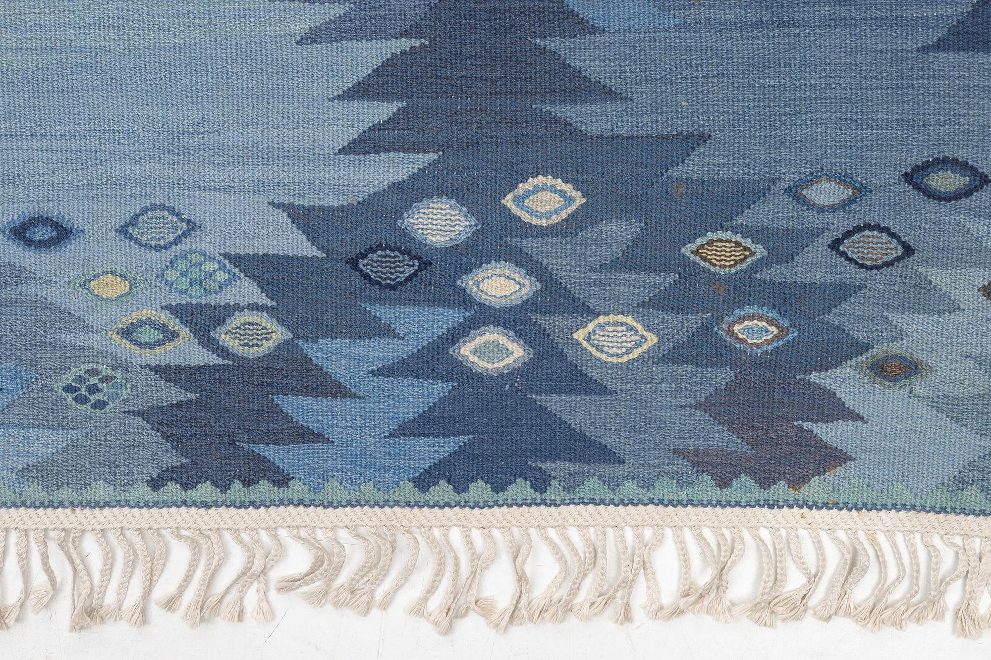 Barbro Nilsson, a carpet, 'Tånga mellanblå', flat weave, c. 350 x 252 cm, signed AB MMF BN.
