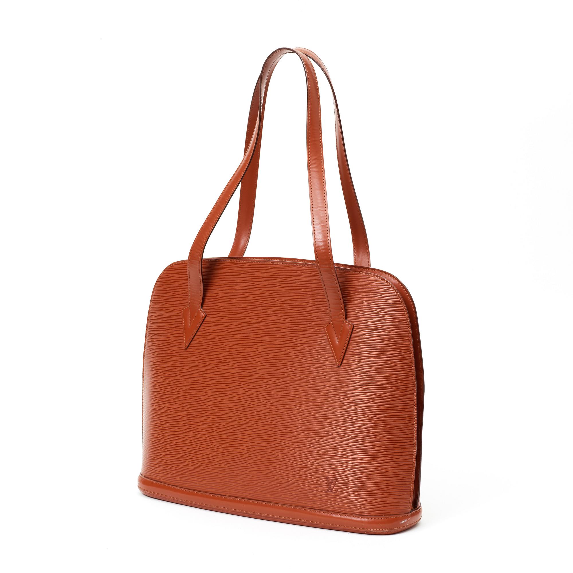 A 1999 terracotta epi leather handbag by Louis Vuitton.