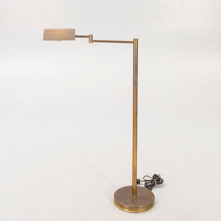 A 21st century brass floor lamp.