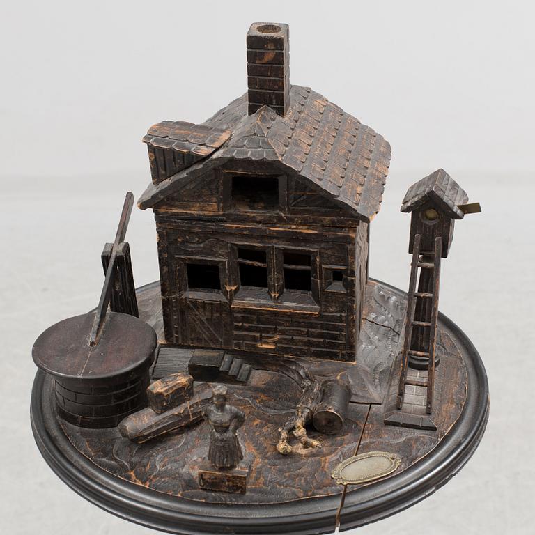 A late 19th century carved smoking table.