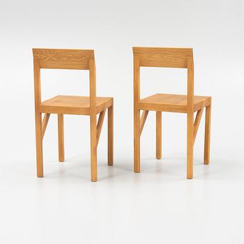 A pair of signed stained pine 'Bracket Chairs' by Frederik Gustav for Frama, Copenhagen 2023.