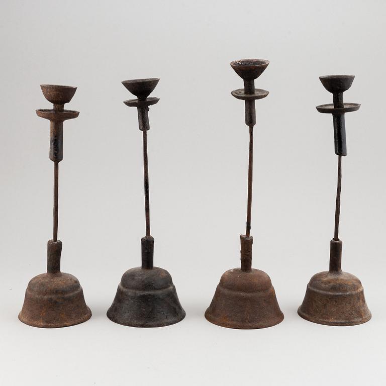 A group of four temple candle sticks, China, 20th Century.