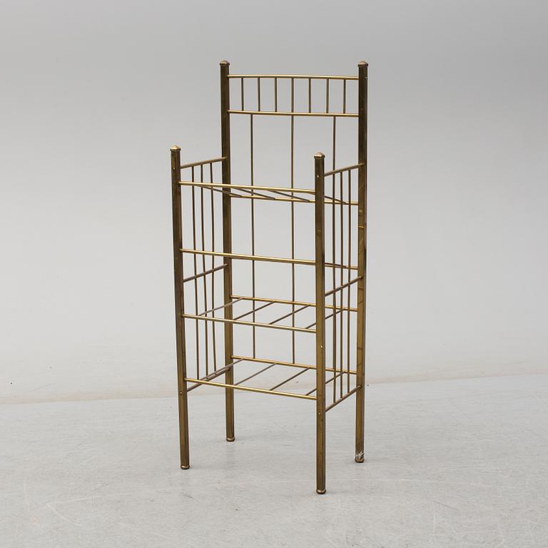 A brass shelf and two flutes, 20th century.