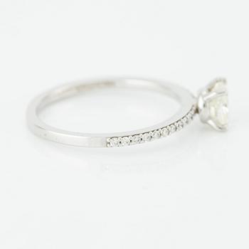 Ring with cushion-cut diamond.