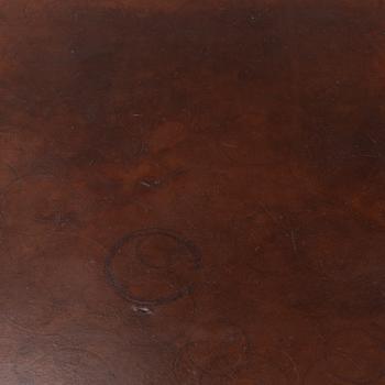 An oak and leather coffee table, mid 20th Century.