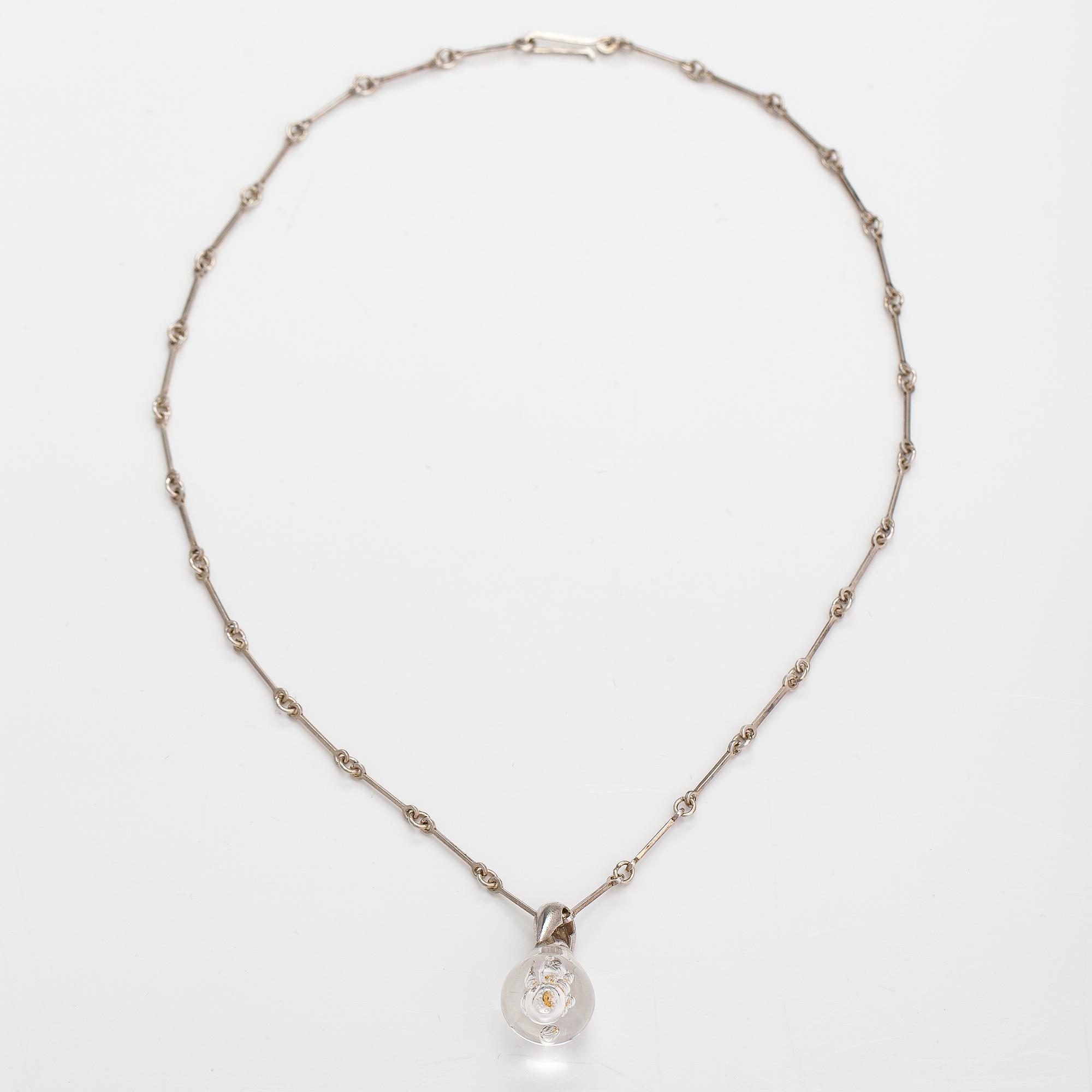 Björn Weckström, "Acrylic nugget", a stelring silver, acrylic necklace with a gold nugget. Lapponia 1979.