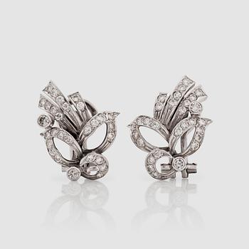 1291. A pair of brilliant-cut diamond earrings.