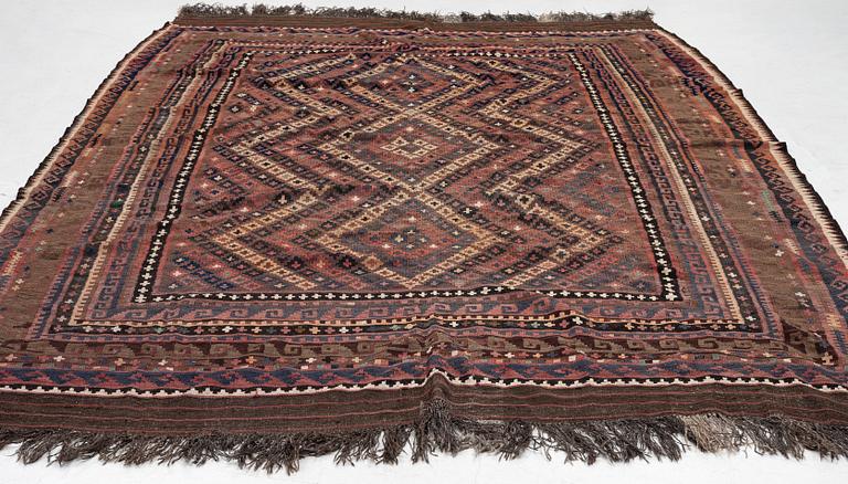 A semi-antique kilim carpet, a. 385 x 251 cm.