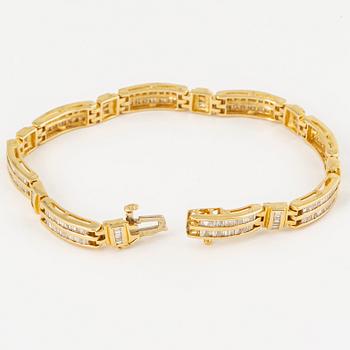 14K gold and small modified baguette cut diamond bracelet.