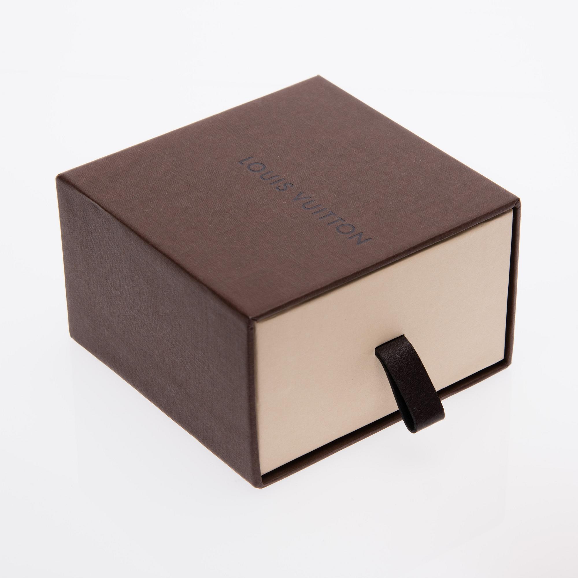 ARMBAND, "Commit", Louis Vuitton.
