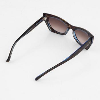 Oliver Goldsmith, a pair of electric tortoise "Orbison" sunglasses.