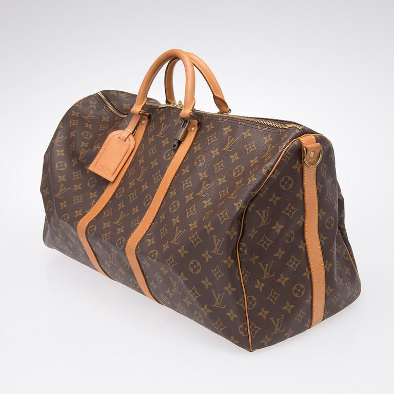 A Keepall Bandouliere 55 WEEKEND BAG by Louis Vuitton.