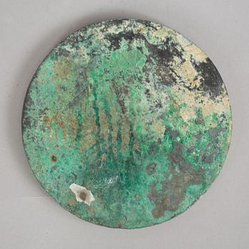 A broze mirror, presumably Tang dynasty (618-907 A.D.).